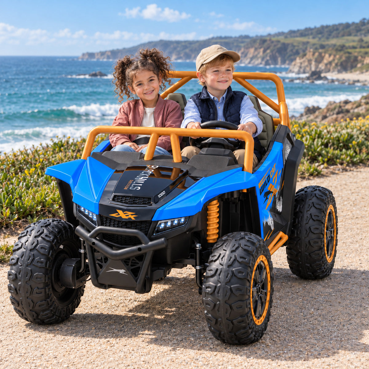 Blue Arctic Cat XL 24V 4WD Two Seat Kids UTV Side by Side, Lifestyle Photo of Two Kids Riding by the Ocean