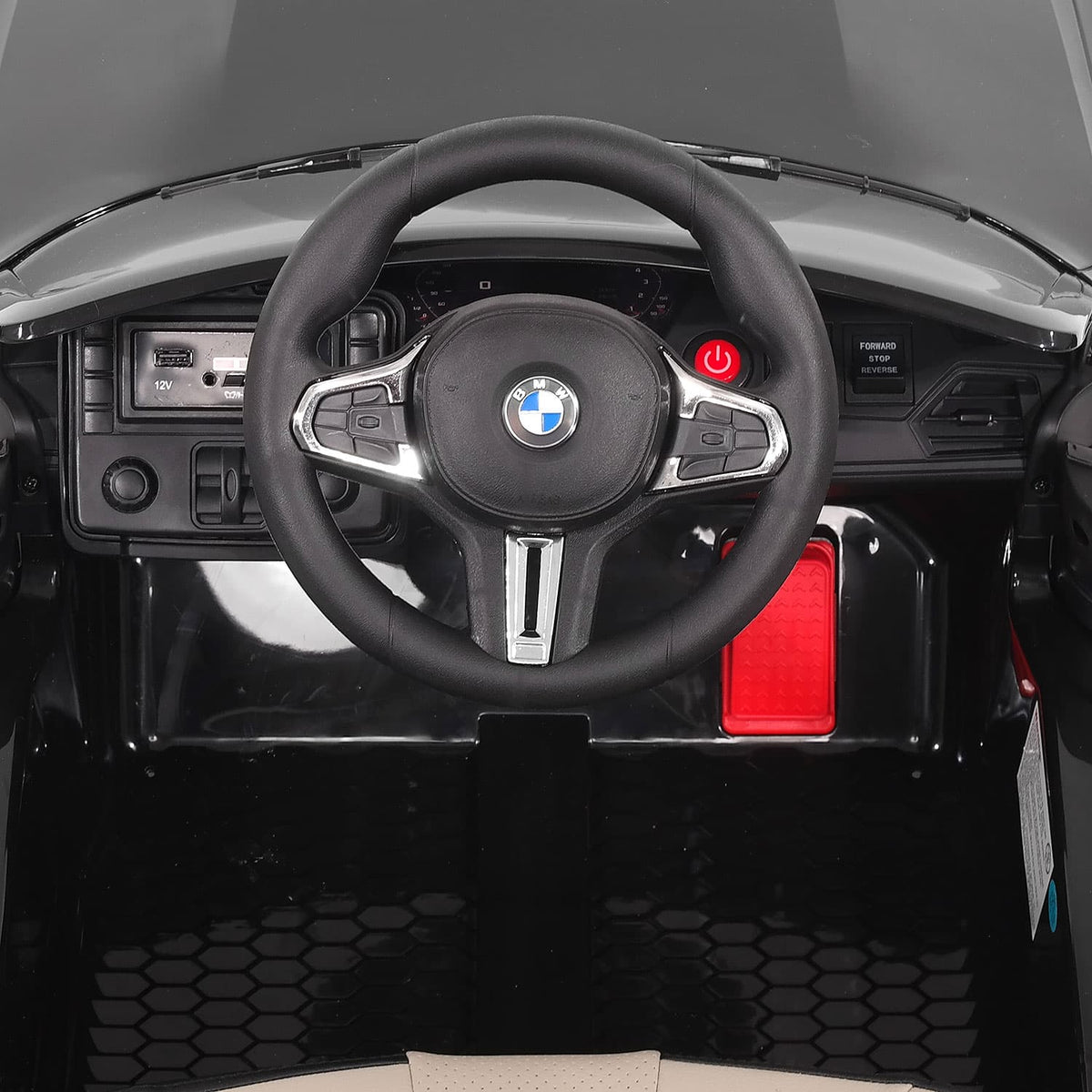 Dashboard with Steering Wheel and Foot Pedal, Straight-On View Inside the BMW M4 12V Kids Car