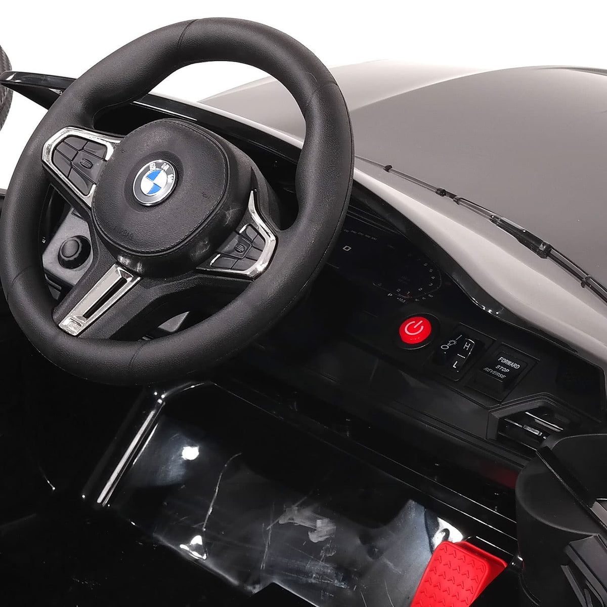 Dashboard Controls and Pedal of the BMW M4 12V Kids Electric Ride-On, Right Angle