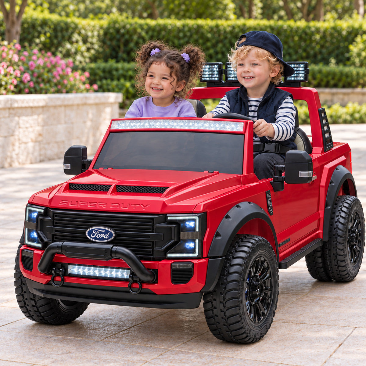 Cherry Red Ford F450 Custom Edition 24V Kids Ride-On Truck, Two Seat Lifestyle Photo of Two Toddlers Driving