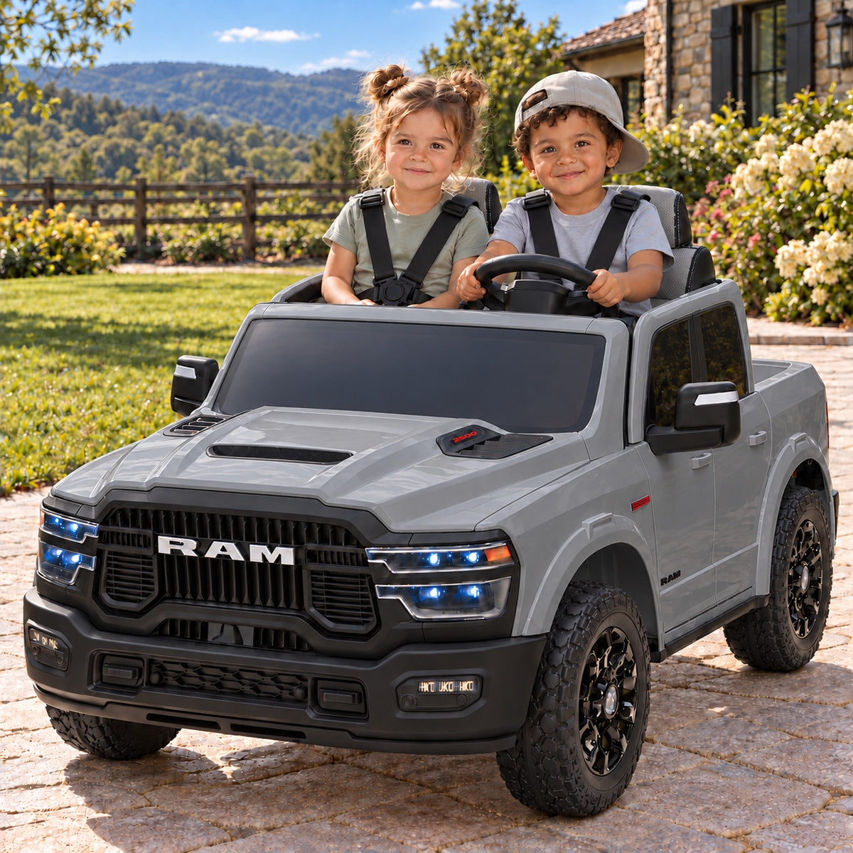 Gray Dodge Ram 2500 Rebel 24V Kids 2 Seater Ride-On Truck, Boy and Girl Driving on a Driveway