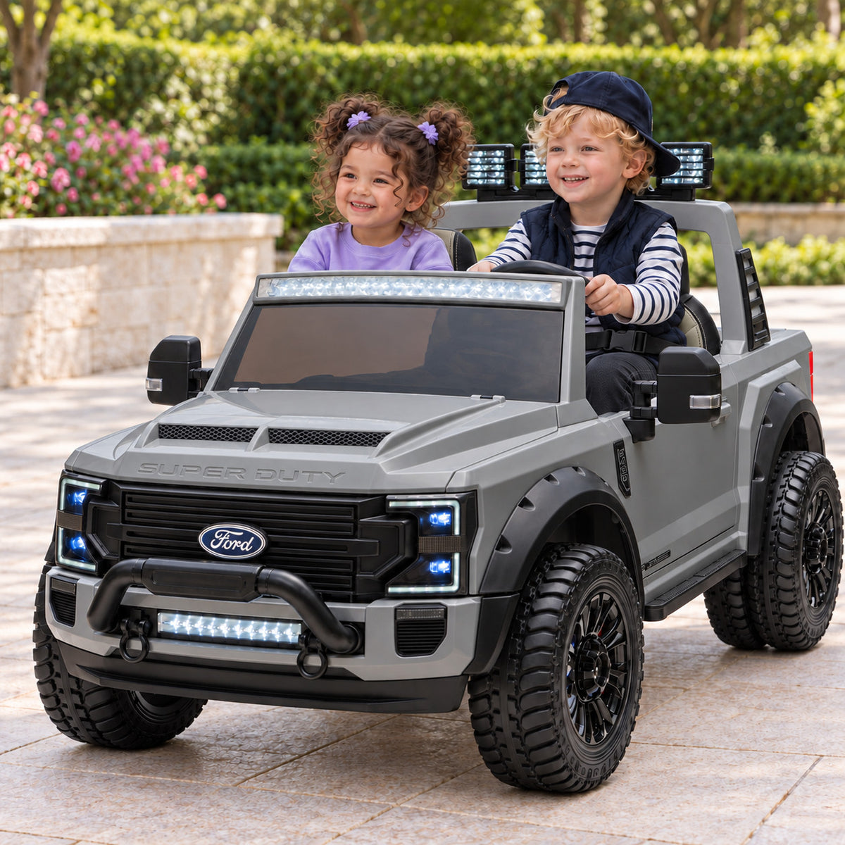 Gray Ford F450 Custom Edition 24V Kids Ride-On Truck, Two Seat Lifestyle Photo of Two Toddlers Driving