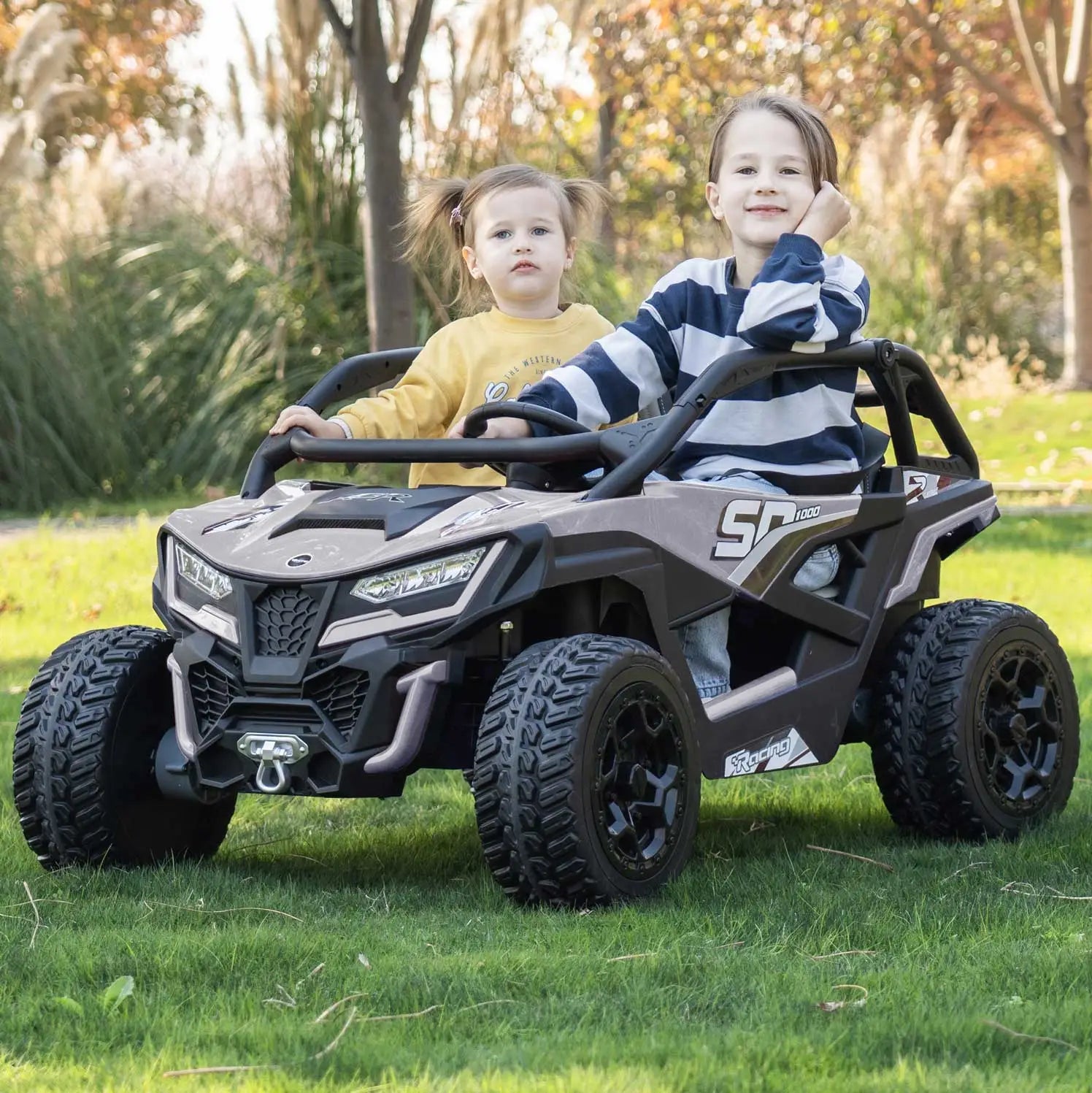 Gray Trail Runner 24V 4WD kids electric ride-on UTV, front view with LED headlights and dual seats