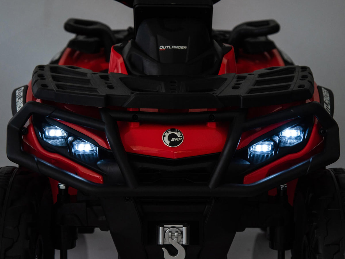 Red Can-Am Outlander 24V Kids Quad with LED Headlights On
