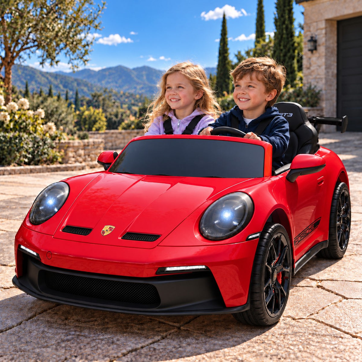 Red Porsche 911 GT3 24V Kids 2 Seater Ride-On Car, Boy and Girl Driving on a Villa Driveway