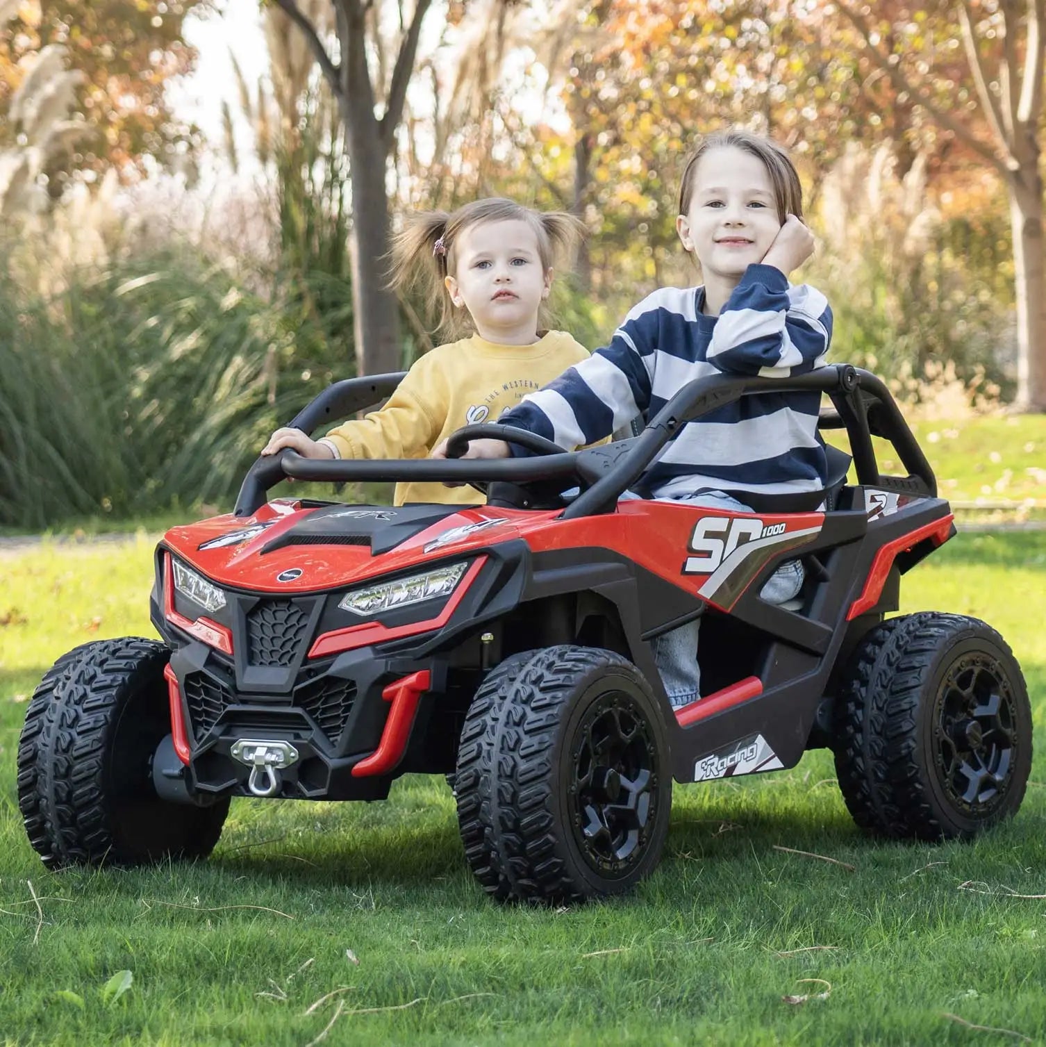 Red Trail Runner 24V 4WD kids electric ride-on UTV, front view with LED headlights and dual seats