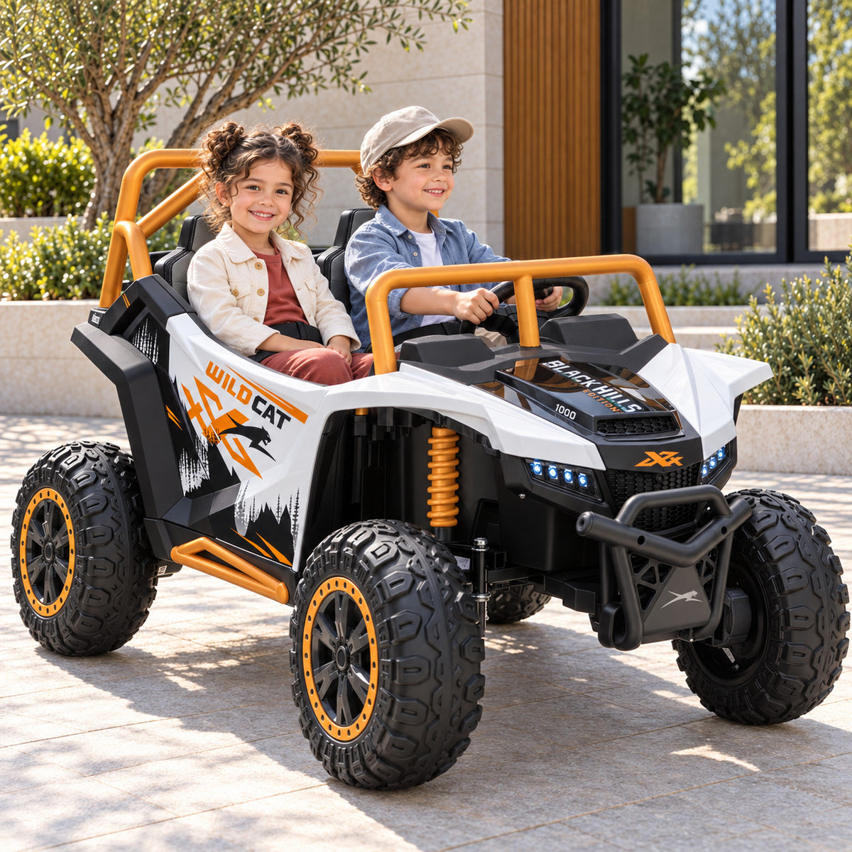 White Arctic Cat XL 24V 4WD Kids Ride-On UTV, Two Seater Lifestyle Photo of Two Kids Driving on a Driveway