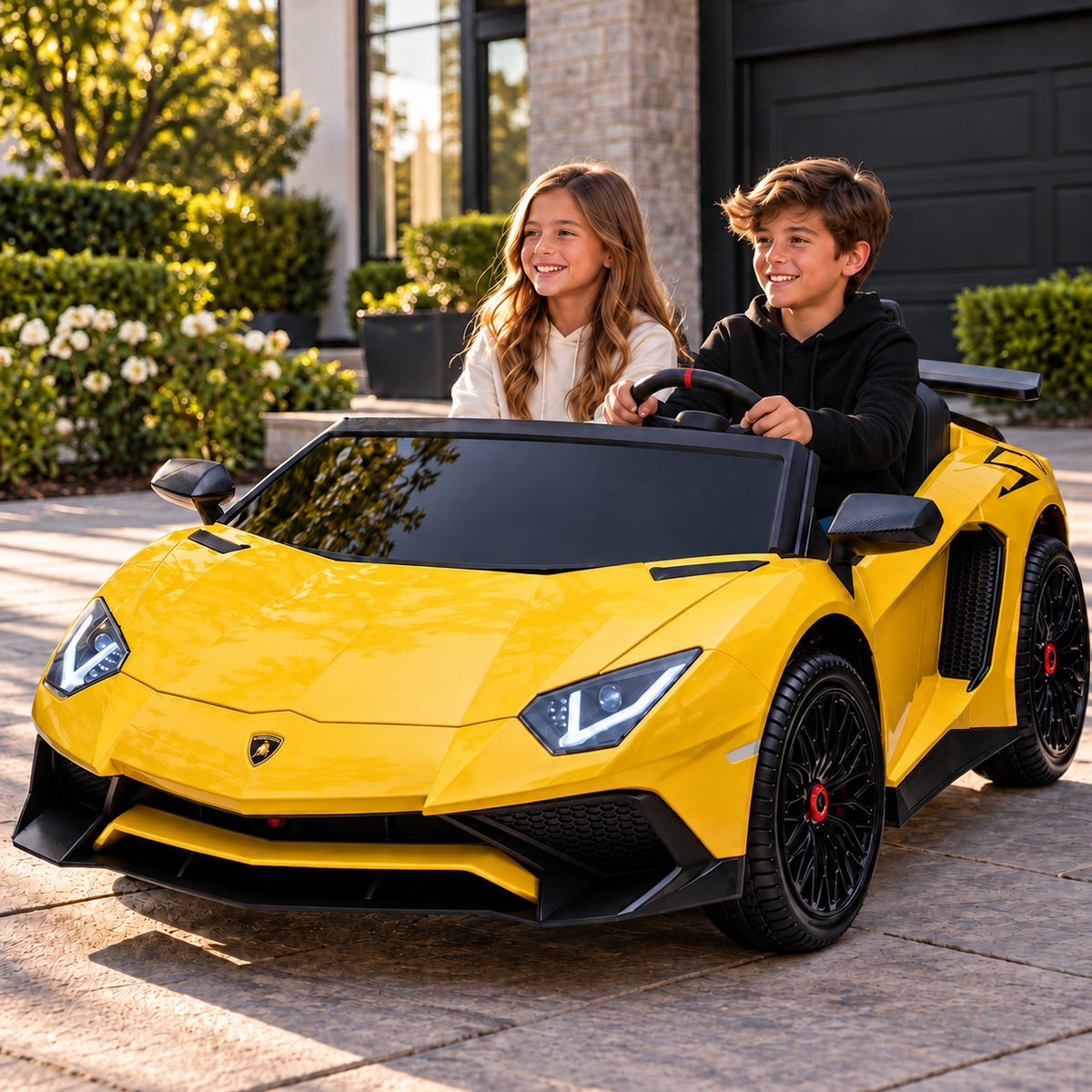 Yellow Lamborghini Aventador XXL 24V Two Seat Ride-On Car for Big Kids Lifestyle, Boy and Girl Driving in Front of the Garage