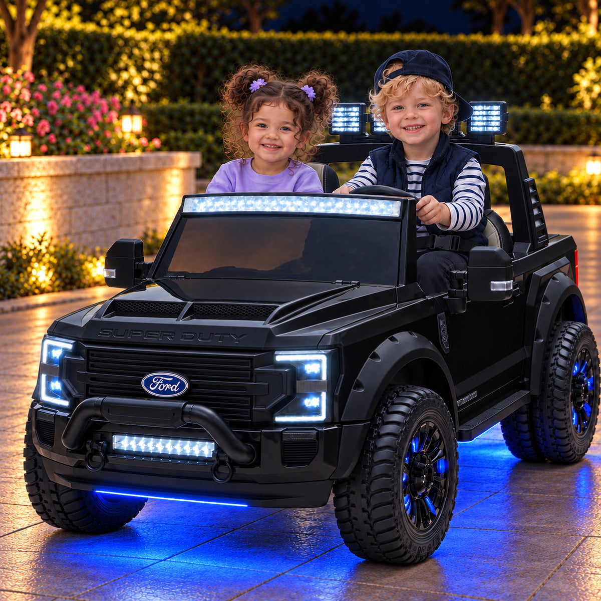 Black Ford F450 24V Kids Ride-On Truck with LED Light Bars and Blue Underbody Lights, Night Lifestyle Photo