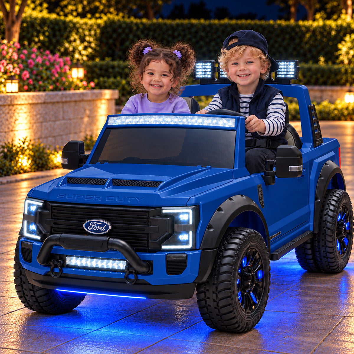 Blue Ford F450 24V Kids Ride-On Truck with LED Light Bars and Blue Underbody Lights, Night Lifestyle Photo