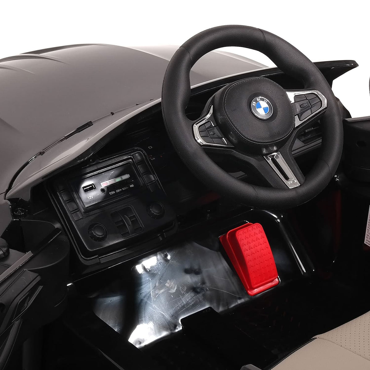 Steering Wheel and Dashboard of the BMW M4 12V Kids Ride-On Car, Left Side Angle