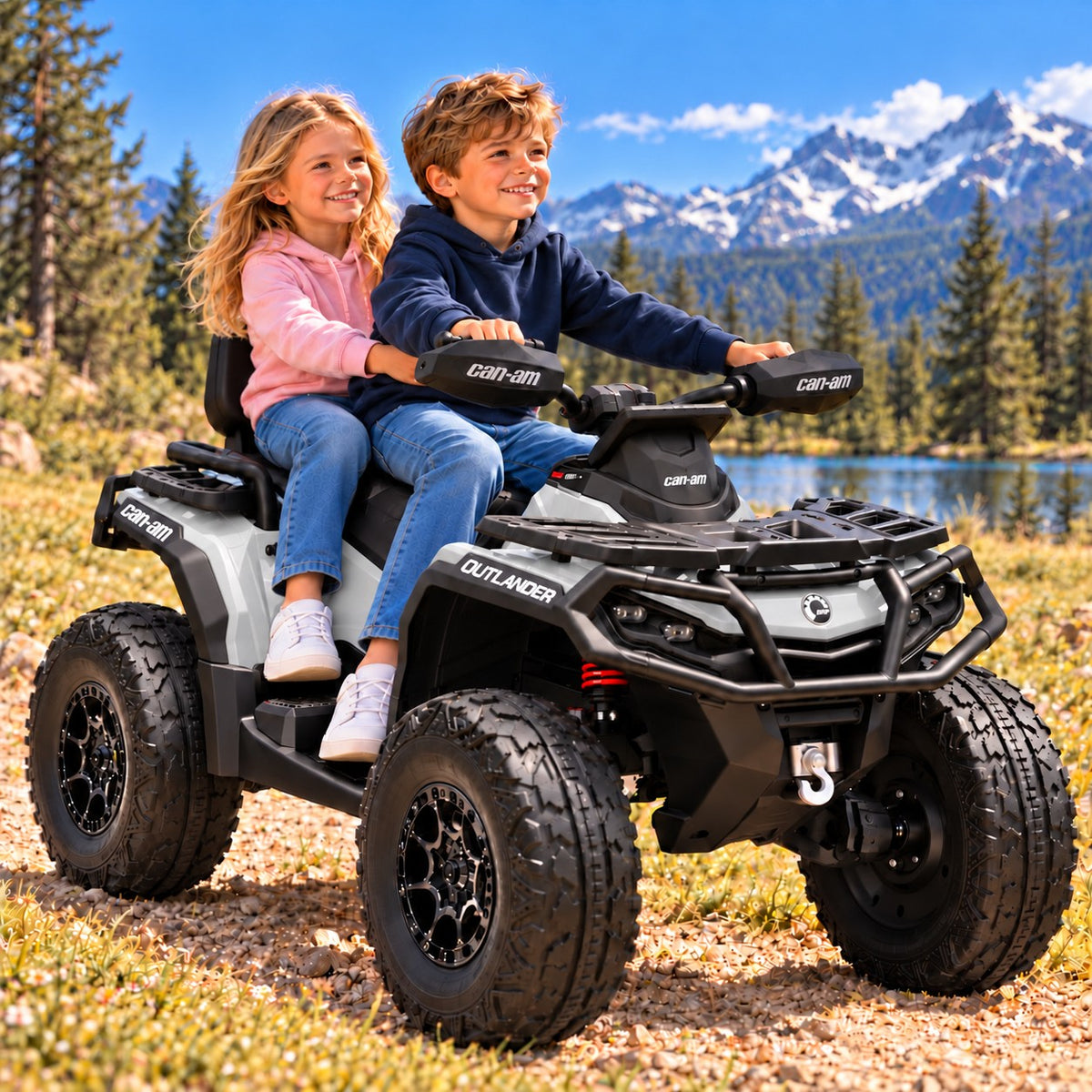 Gray Can-Am Outlander 24V Kids 4 Wheeler – A Boy and Girl Riding the Two-Seater Ride-On ATV by a Mountain Lake