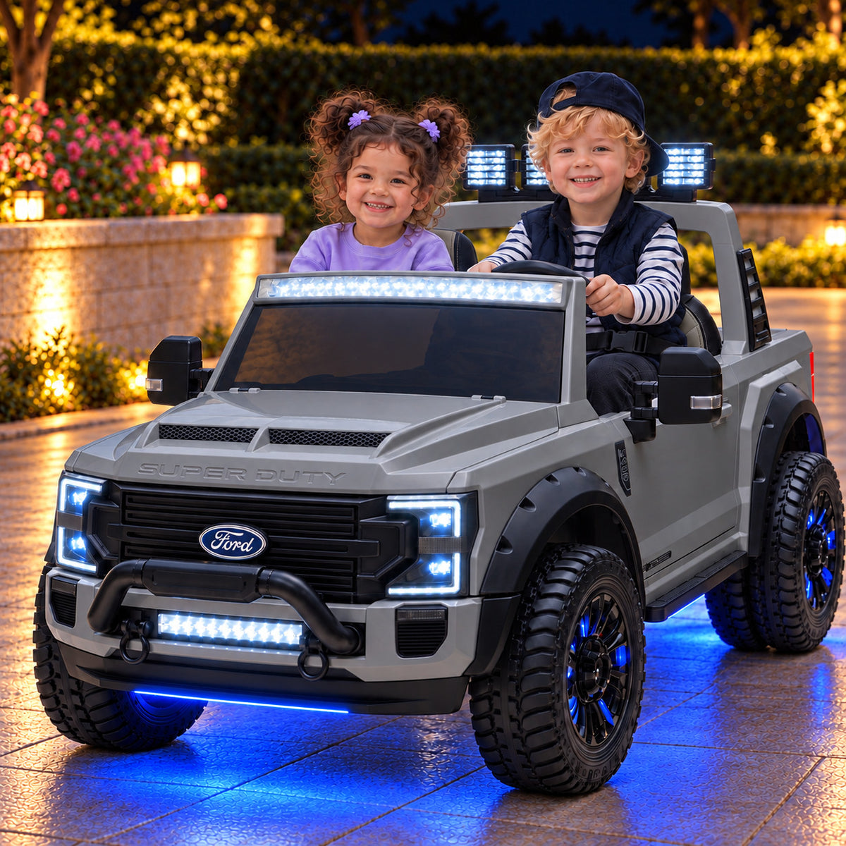 Gray Ford F450 24V Kids Ride-On Truck with LED Light Bars and Blue Underbody Lights, Night Lifestyle Photo