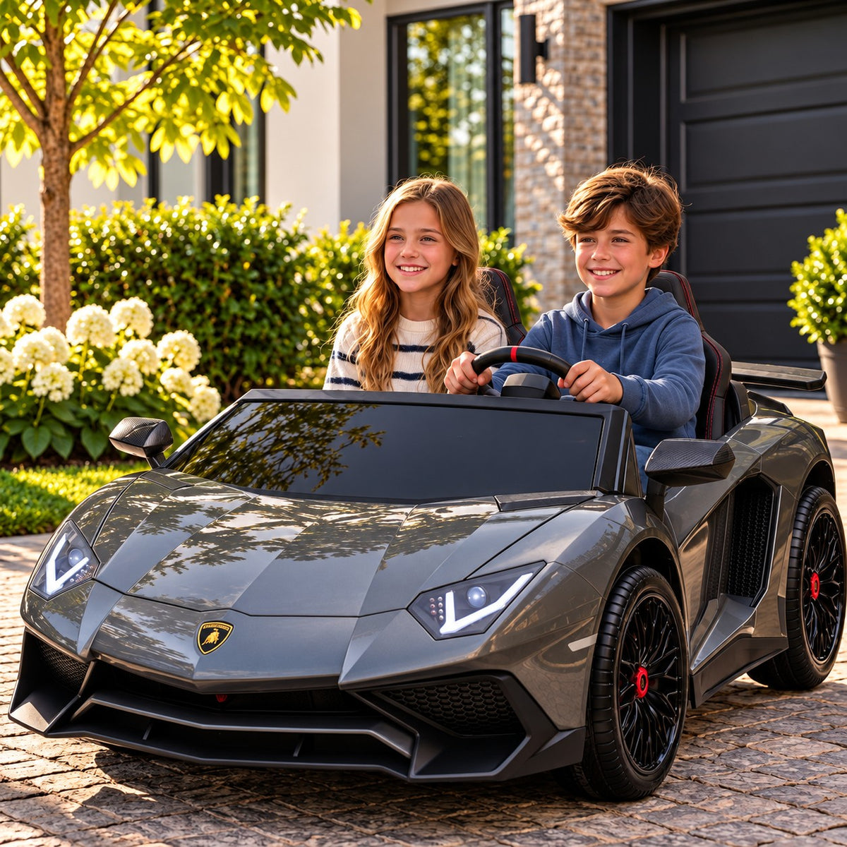 Gray Lamborghini Aventador XXL 24V Two Seat Ride-On Car for Big Kids Lifestyle, Boy and Girl Driving in Front of the Garage