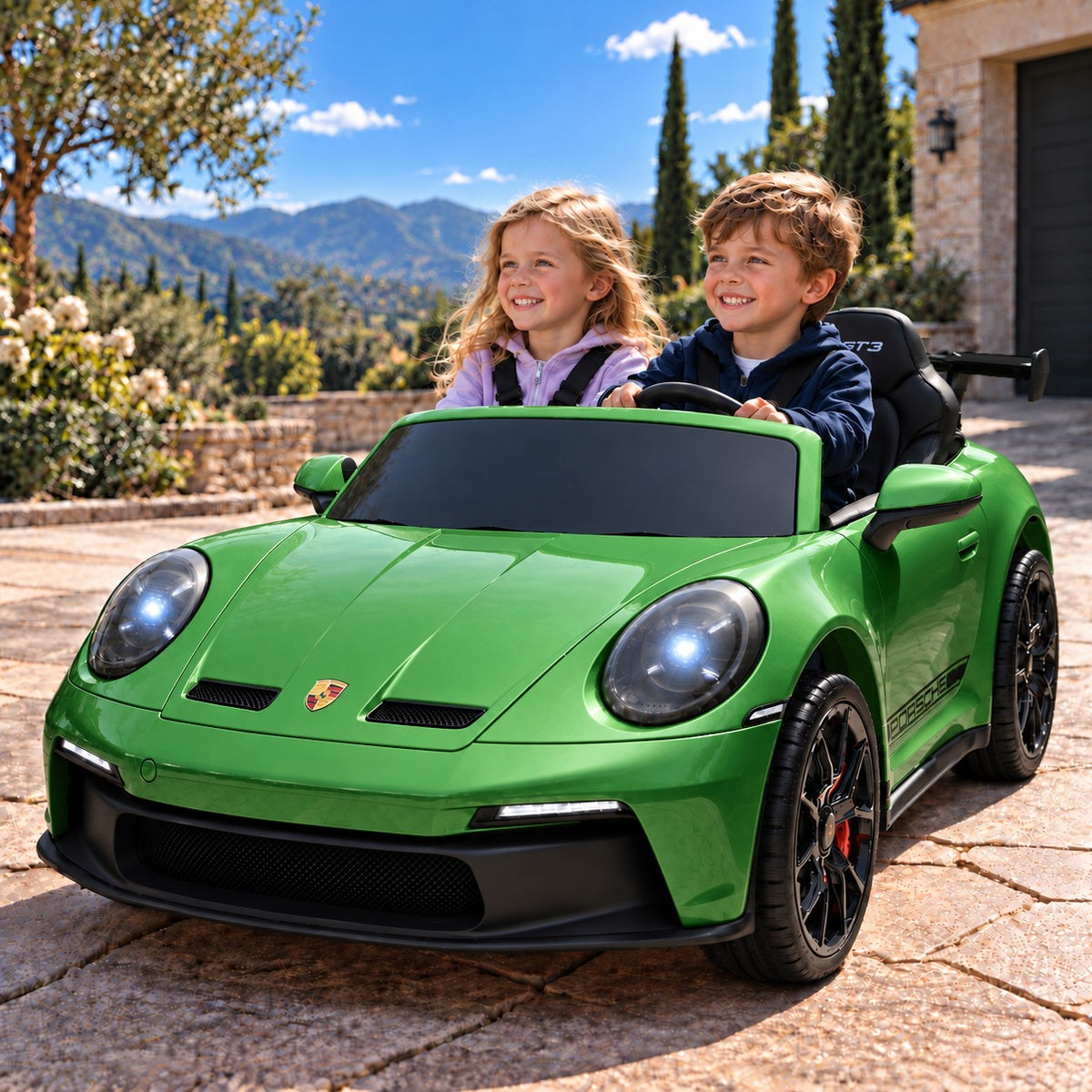 Green Porsche 911 GT3 24V Kids 2 Seater Ride-On Car, Boy and Girl Driving on a Villa Driveway
