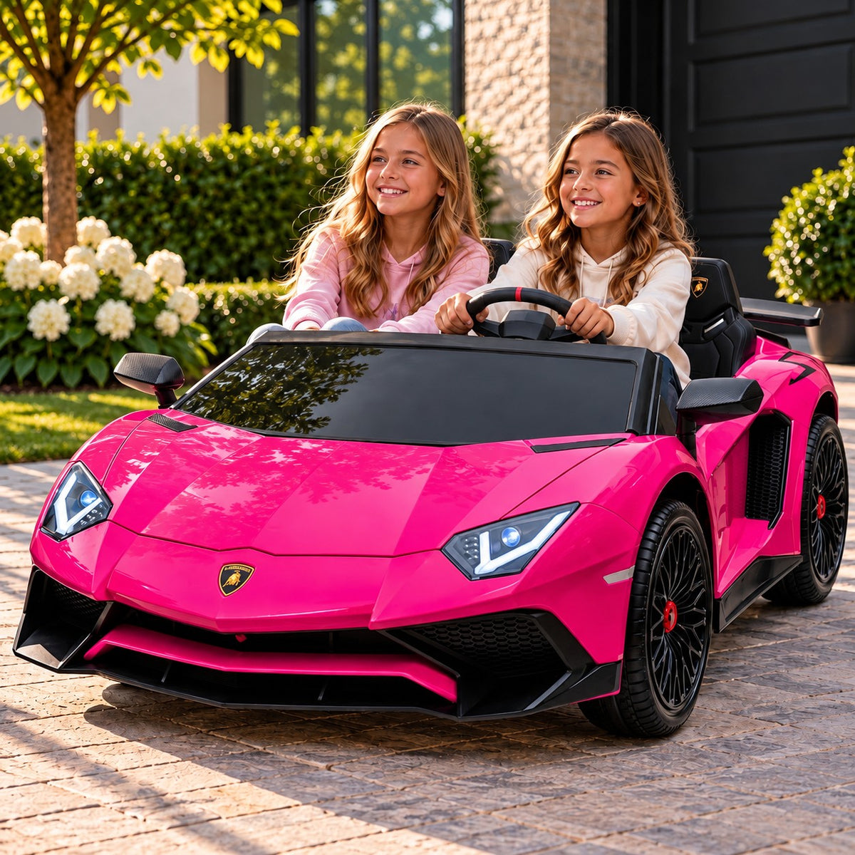 Pink Lamborghini Aventador XXL 24V Two Seat Ride-On Car for Big Kids Lifestyle, Two Girls Driving in Front of the Garage