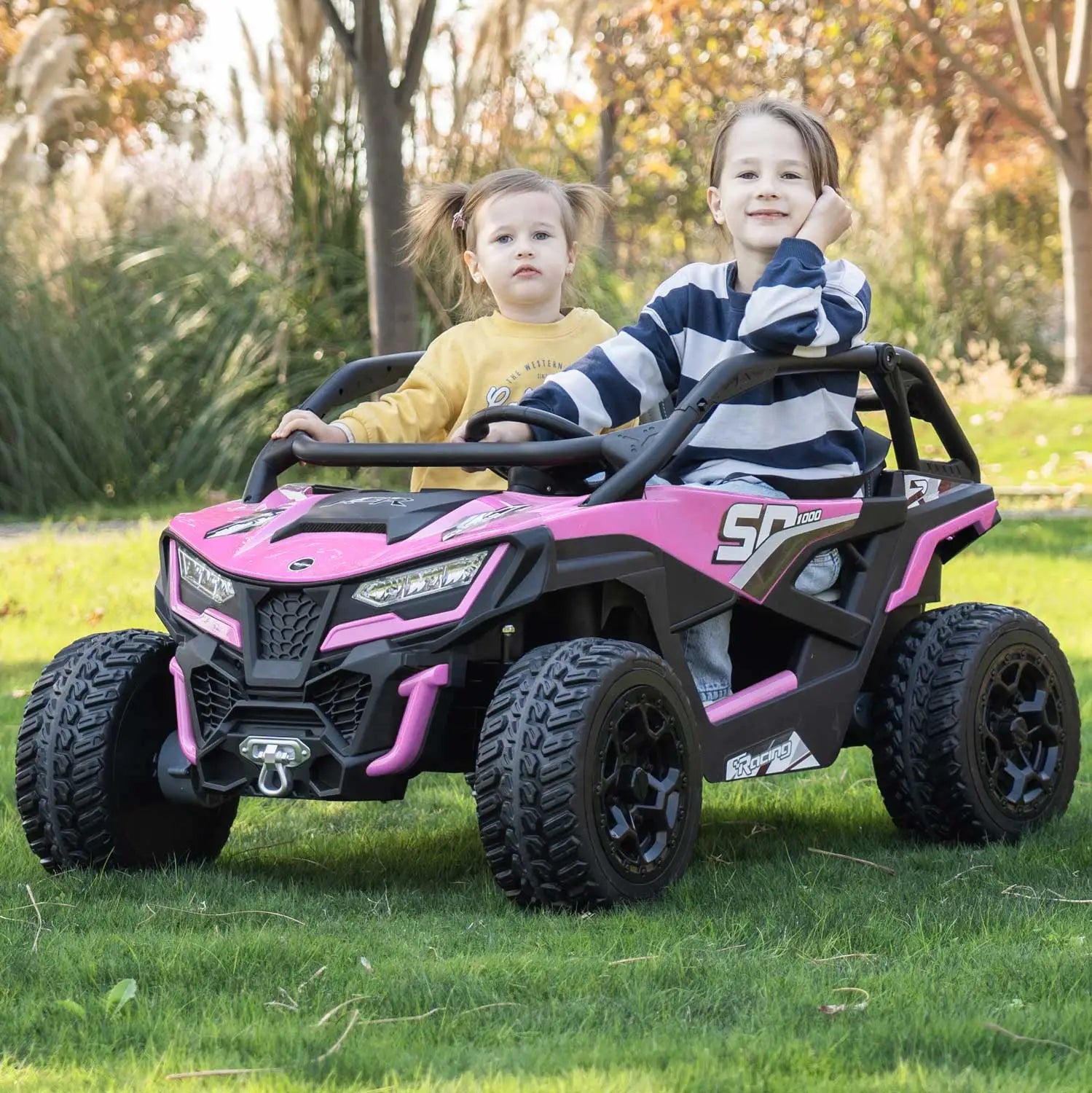 Pink Trail Runner 24V 4WD kids electric ride-on UTV, front view with LED headlights and dual seats