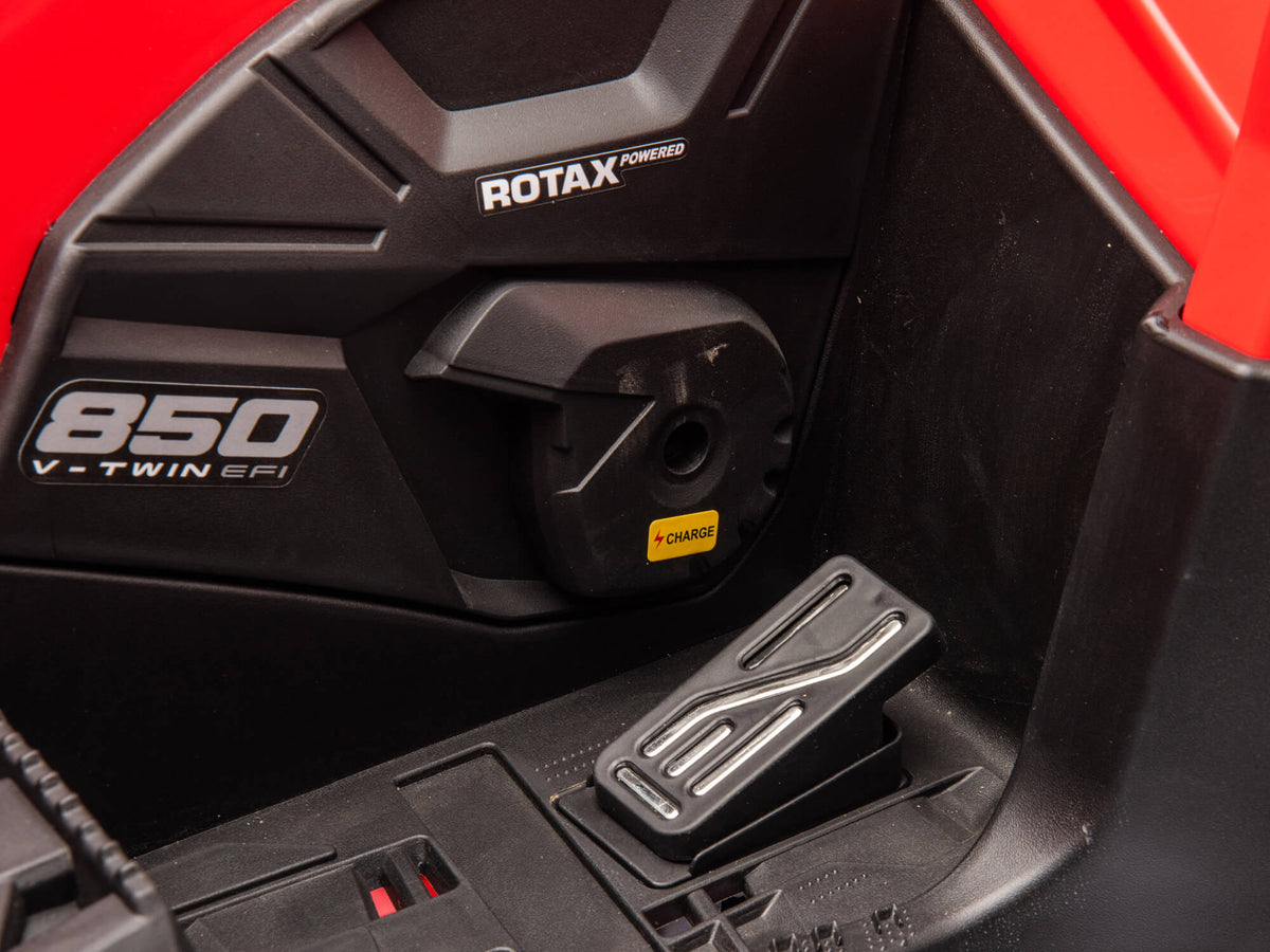 Footrest on the Red Can-Am Outlander Kids Ride-On Quad