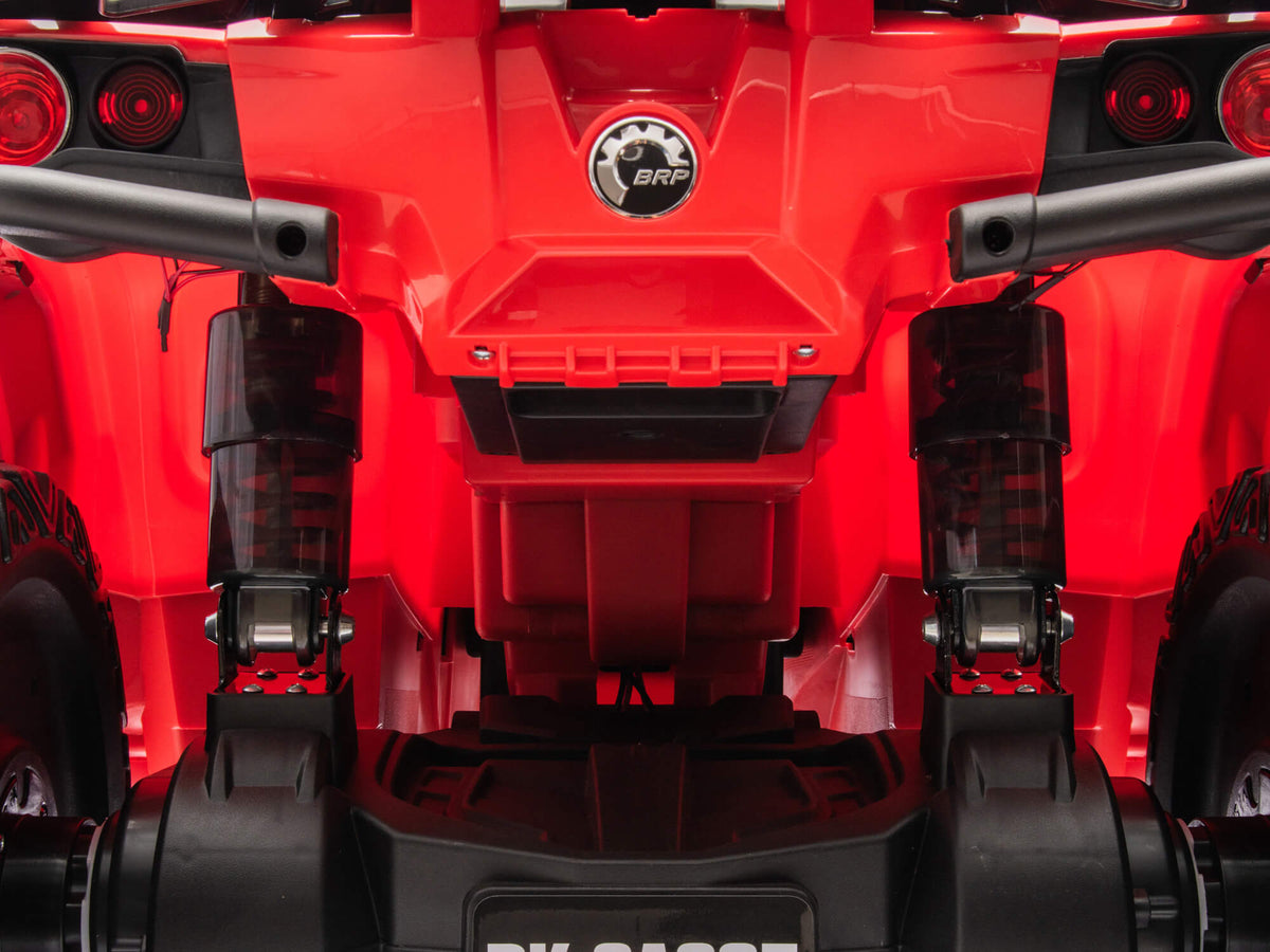 Rear Suspension Close-Up on the Red Can-Am Outlander 4WD Kids ATV