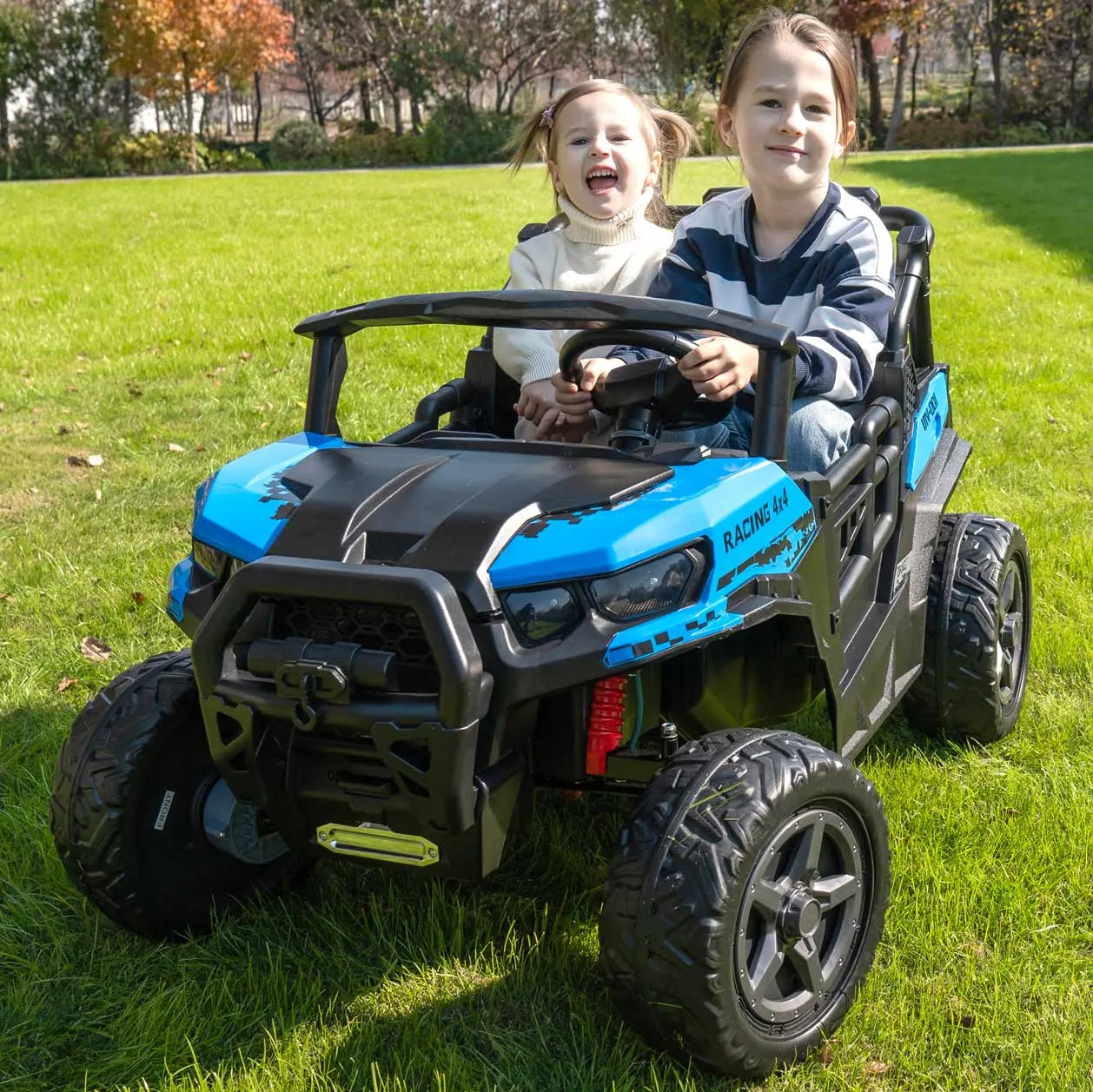 Blue Trail Rider 24V 4WD kids electric ride-on UTV, front view with LED headlights, roof light bar, and dual seats