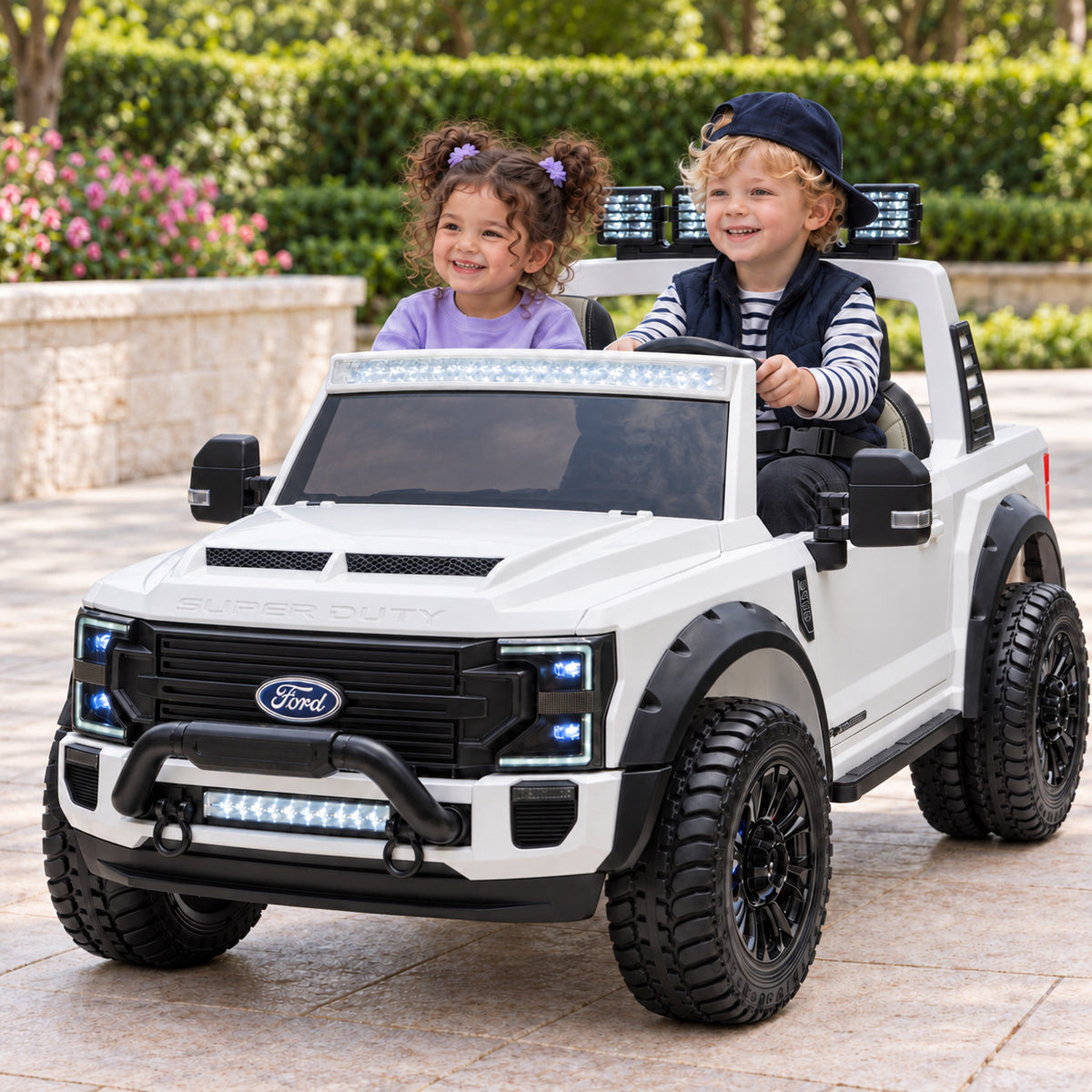White Ford F450 Custom Edition 24V Kids Ride-On Truck, Two Seat Lifestyle Photo of Two Toddlers Driving