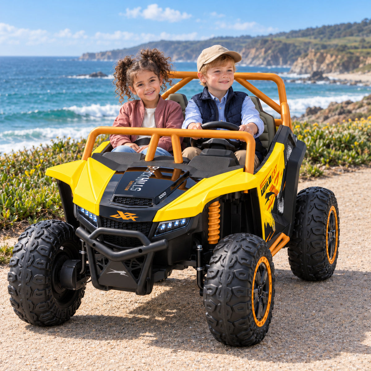 Yellow Arctic Cat XL 24V 4WD Two Seat Kids UTV Side by Side, Lifestyle Photo of Two Kids Riding by the Ocean